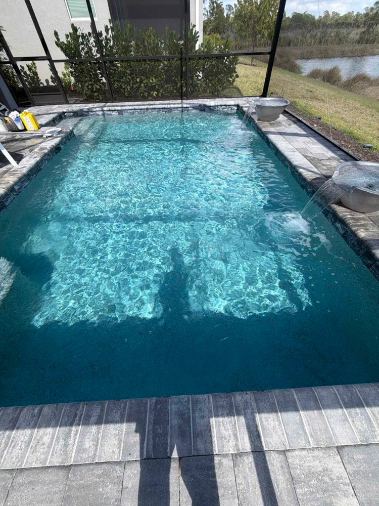 Rectangular pool with clear blue water on a weekly service route