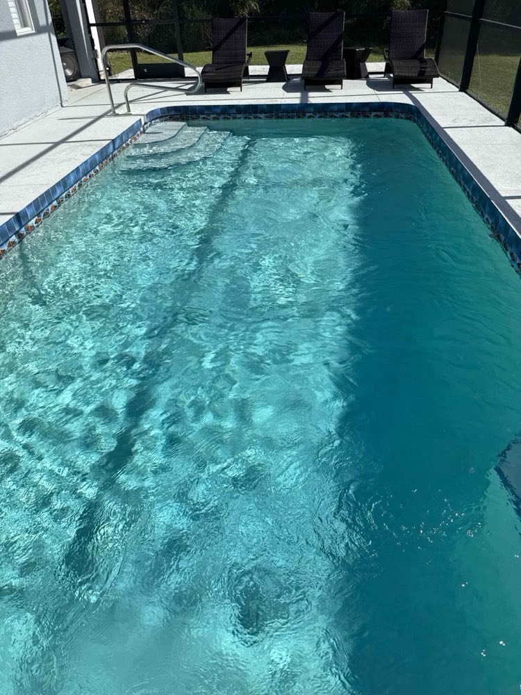 Pool deck and clear water after a full service visit