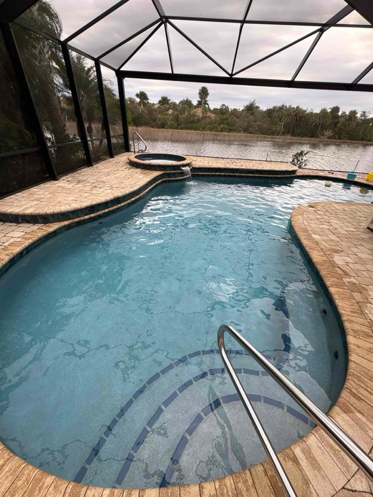 Kidney-shaped pool kept in top condition year round