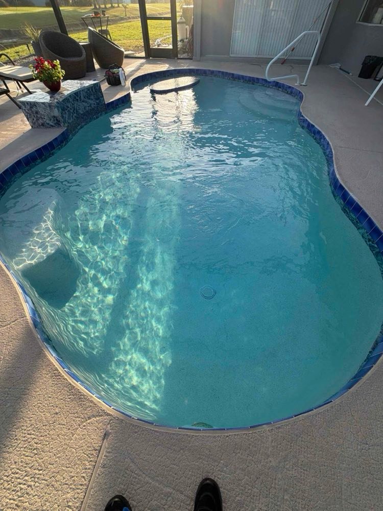 Screened pool enclosure with balanced, sparkling water
